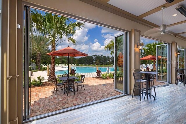 454 Captiva Dr, Davenport, FL 33896 - doorway to outside with wood finished floors and ceiling fan