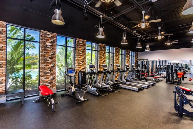 454 Captiva Dr, Davenport, FL 33896 - workout area featuring brick wall and a ceiling fan