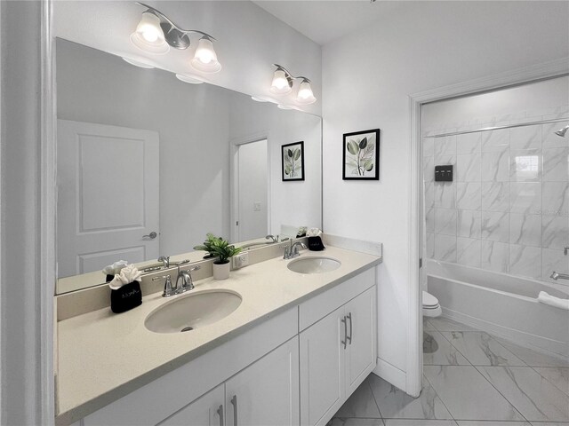 454 Captiva Dr, Davenport, FL 33896 - bathroom with marble finish floors, double vanity, toilet, and bathing tub / shower combination