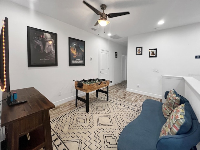 454 Captiva Dr, Davenport, FL 33896 - living area featuring light wood-style flooring, a ceiling fan, recessed lighting, and baseboards