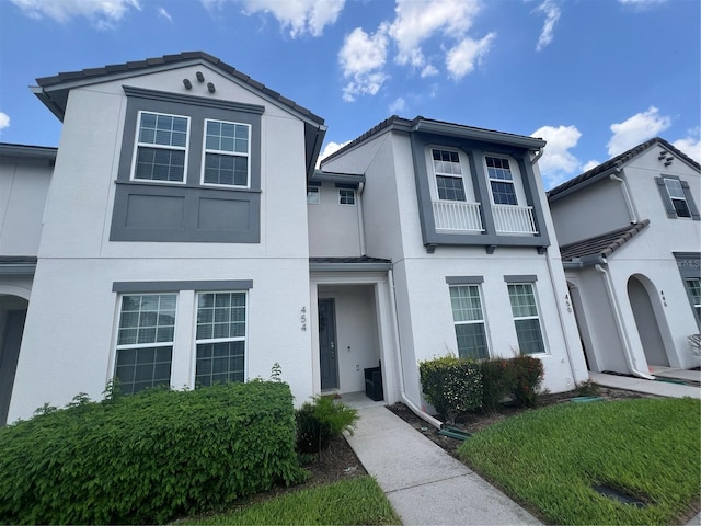 454 Captiva Dr, Davenport, FL 33896 - view of front facade featuring stucco siding