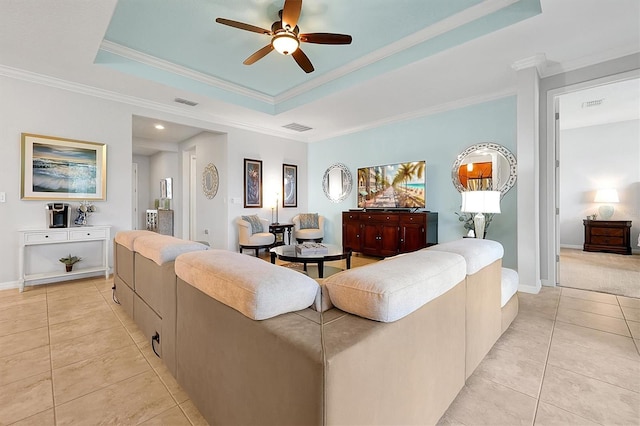 634 Via Corso Ct, Kissimmee, FL 34759 - living area featuring light tile patterned floors, a ceiling fan, a tray ceiling, crown molding, and recessed lighting