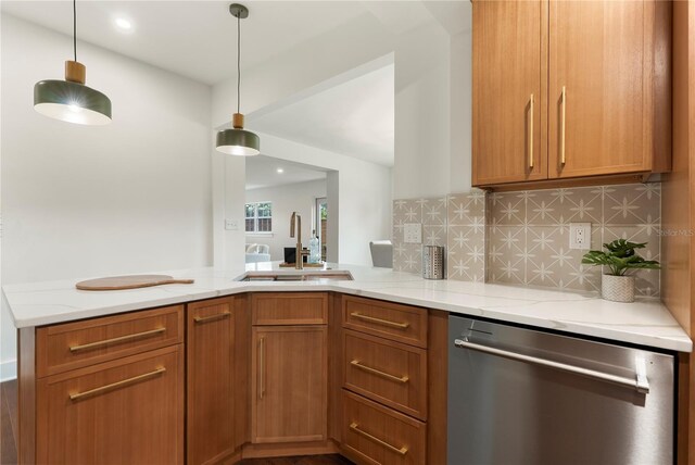 1401 Canberra Ave, Orlando, FL 32806 - kitchen featuring stainless steel dishwasher, a sink, light stone counters, a peninsula, and tasteful backsplash