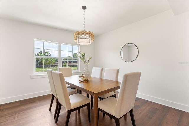 1401 Canberra Ave, Orlando, FL 32806 - dining space featuring baseboards, dark wood finished floors, and a chandelier