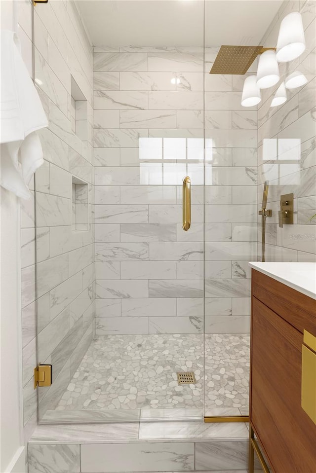 1401 Canberra Ave, Orlando, FL 32806 - bathroom featuring a shower stall, marble finish flooring, and vanity