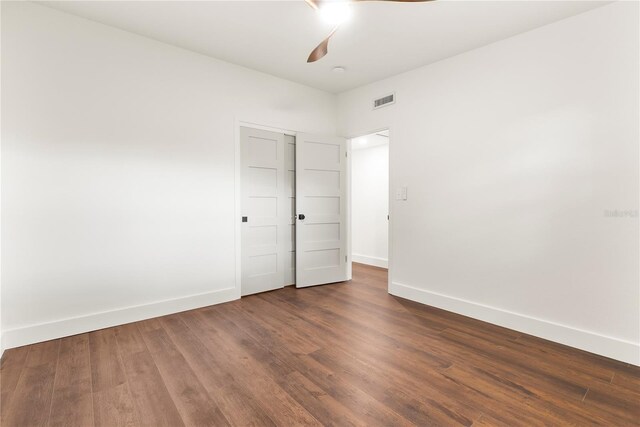 1401 Canberra Ave, Orlando, FL 32806 - unfurnished bedroom with baseboards, wood finished floors, and a ceiling fan