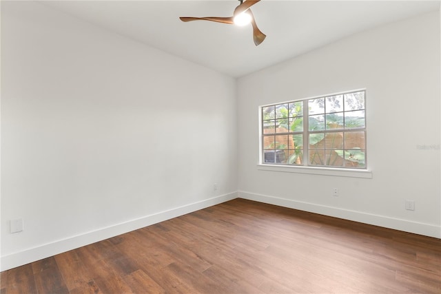 1401 Canberra Ave, Orlando, FL 32806 - spare room with wood finished floors, baseboards, and ceiling fan