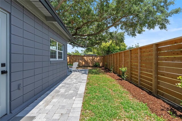 1401 Canberra Ave, Orlando, FL 32806 - fenced backyard with a patio area