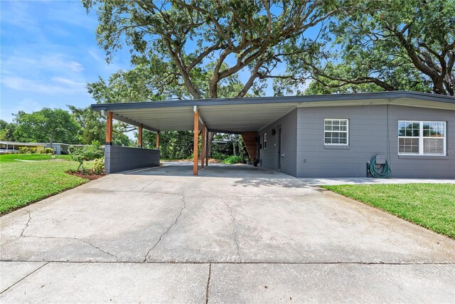 1401 Canberra Ave, Orlando, FL 32806 - view of car parking with driveway and a carport