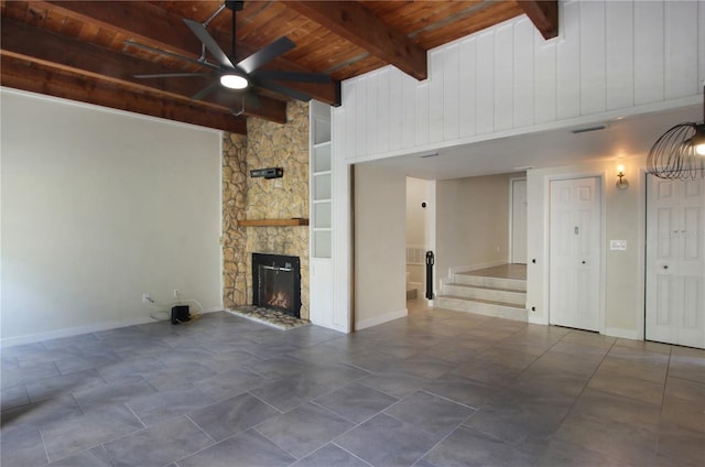 115 Tomoka Trl Unit 115, Longwood, FL 32779 - unfurnished living room with wooden ceiling with exposed beams, a ceiling fan, a fireplace, stairs, and baseboards