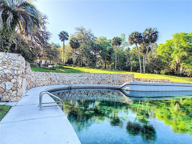 115 Tomoka Trl Unit 115, Longwood, FL 32779 - view of pool featuring a yard and view of scattered trees
