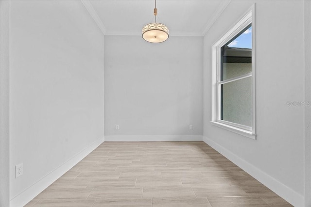 19073 Sabal St, Orlando, FL 32833 - empty room with ornamental molding, plenty of natural light, baseboards, and light wood-style flooring