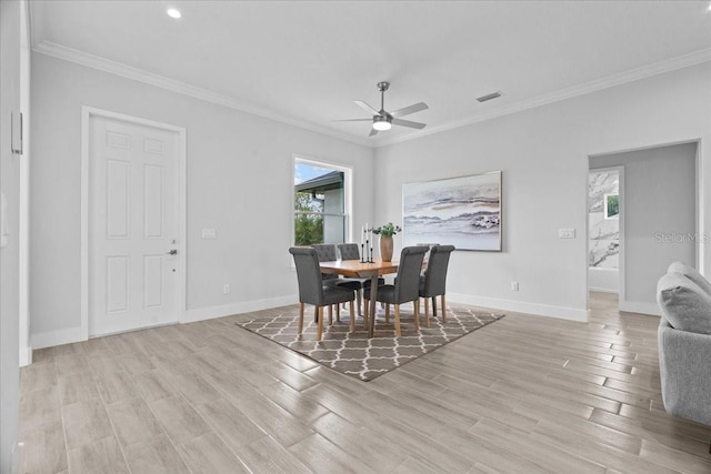 19073 Sabal St, Orlando, FL 32833 - dining room with ceiling fan, crown molding, light wood finished floors, baseboards, and recessed lighting