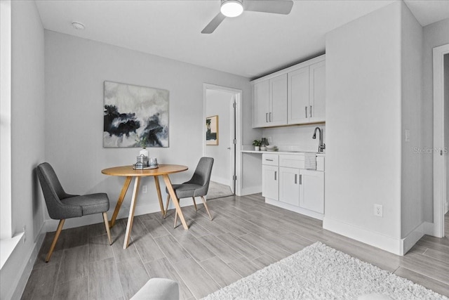 19073 Sabal St, Orlando, FL 32833 - office area featuring light wood-type flooring, baseboards, and a ceiling fan