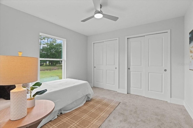19073 Sabal St, Orlando, FL 32833 - bedroom featuring carpet, multiple closets, baseboards, and ceiling fan
