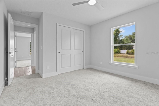 19073 Sabal St, Orlando, FL 32833 - unfurnished bedroom with carpet flooring, baseboards, a closet, and ceiling fan