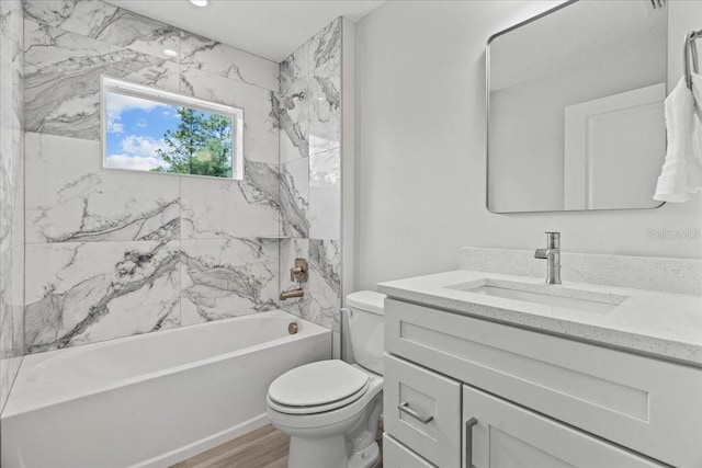 19073 Sabal St, Orlando, FL 32833 - full bathroom with toilet, vanity, shower / bathtub combination, and wood finished floors