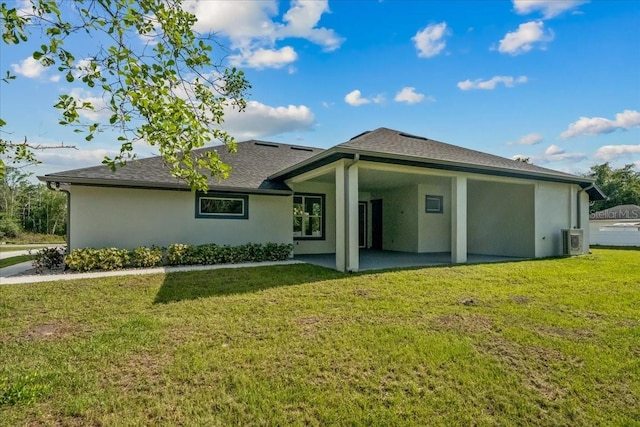 19073 Sabal St, Orlando, FL 32833 - rear view of property featuring stucco siding, a patio, a lawn, and ac unit
