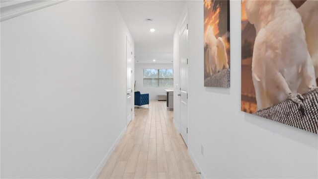733 Longboat Dr, Davenport, FL 33896 - hall featuring light wood-type flooring, baseboards, and recessed lighting