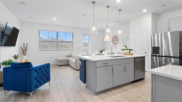 733 Longboat Dr, Davenport, FL 33896 - kitchen featuring appliances with stainless steel finishes, a sink, gray cabinetry, light countertops, and recessed lighting
