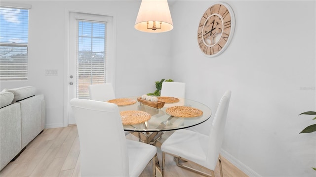 733 Longboat Dr, Davenport, FL 33896 - dining room featuring light wood-style flooring and baseboards