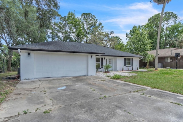 single story home featuring driveway, a front yard, cooling unit, stucco siding, and a garage