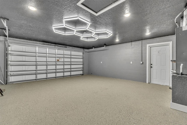 garage featuring concrete block wall