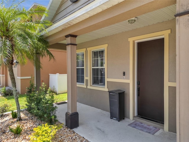 325 Aldridge Ln, Davenport, FL 33897 - view of exterior entry featuring stucco siding