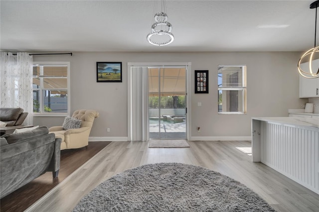 325 Aldridge Ln, Davenport, FL 33897 - interior space featuring healthy amount of natural light, baseboards, and wood finished floors