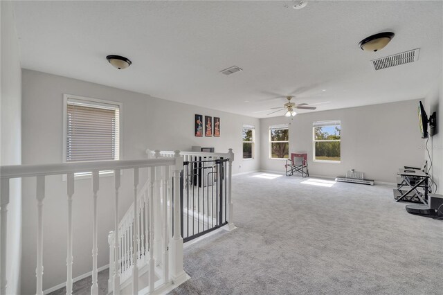 325 Aldridge Ln, Davenport, FL 33897 - unfurnished room featuring an upstairs landing, carpet floors, ceiling fan, and baseboards