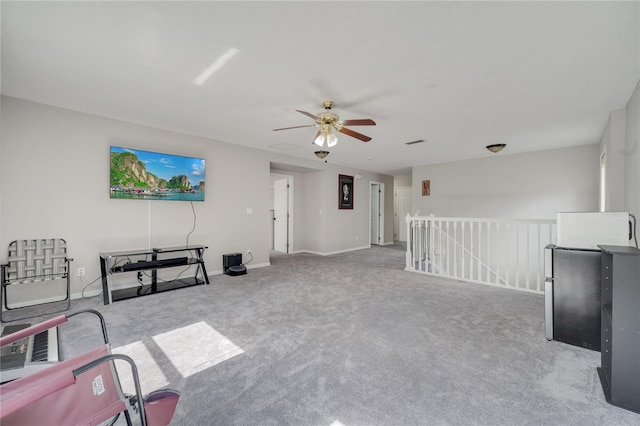 325 Aldridge Ln, Davenport, FL 33897 - unfurnished living room featuring a ceiling fan, carpet flooring, and baseboards