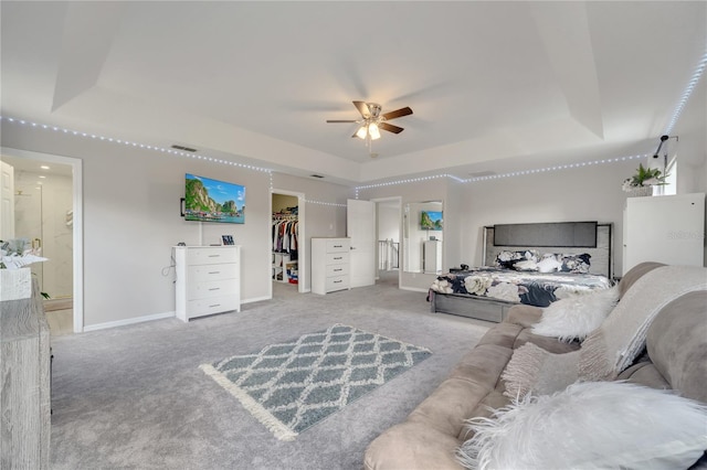 325 Aldridge Ln, Davenport, FL 33897 - carpeted living area with a raised ceiling, a ceiling fan, and baseboards