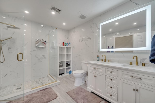 325 Aldridge Ln, Davenport, FL 33897 - full bathroom featuring tile walls, a marble finish shower, toilet, double vanity, and wood finished floors