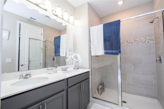 12133 Bracco St, Winter Garden, FL 34787 - full bathroom with a stall shower, double vanity, and recessed lighting