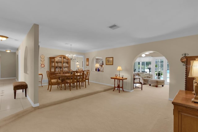 303 S Sweetwater Blvd, Longwood, FL 32779 - dining space featuring light carpet, arched walkways, and baseboards