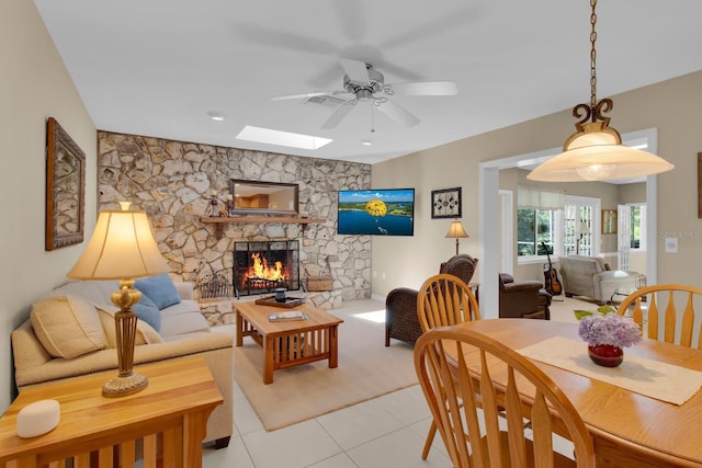 303 S Sweetwater Blvd, Longwood, FL 32779 - dining area featuring ceiling fan, a skylight, a fireplace, and light tile patterned floors