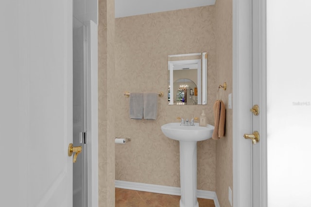 303 S Sweetwater Blvd, Longwood, FL 32779 - bathroom with tile patterned flooring, a sink, baseboards, and wallpapered walls