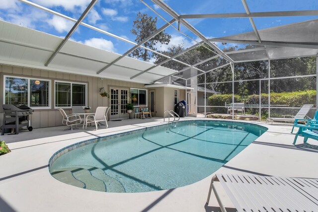 303 S Sweetwater Blvd, Longwood, FL 32779 - swimming pool featuring a patio area, grilling area, french doors, and a lanai