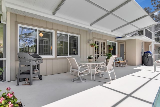 303 S Sweetwater Blvd, Longwood, FL 32779 - view of patio / terrace featuring area for grilling, glass enclosure, and outdoor dining space