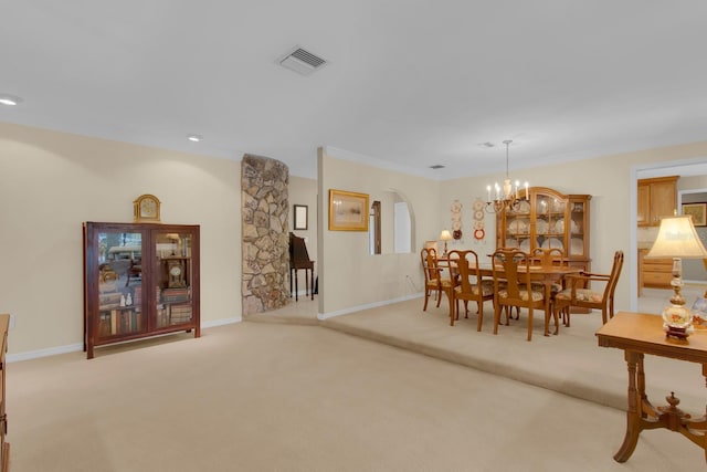 303 S Sweetwater Blvd, Longwood, FL 32779 - dining area with light carpet, a chandelier, arched walkways, baseboards, and recessed lighting