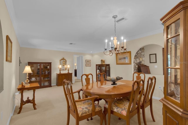 303 S Sweetwater Blvd, Longwood, FL 32779 - dining space with arched walkways, light colored carpet, a chandelier, and baseboards