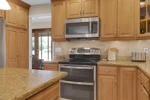 303 S Sweetwater Blvd, Longwood, FL 32779 - kitchen featuring stainless steel appliances, tasteful backsplash, french doors, and glass insert cabinets