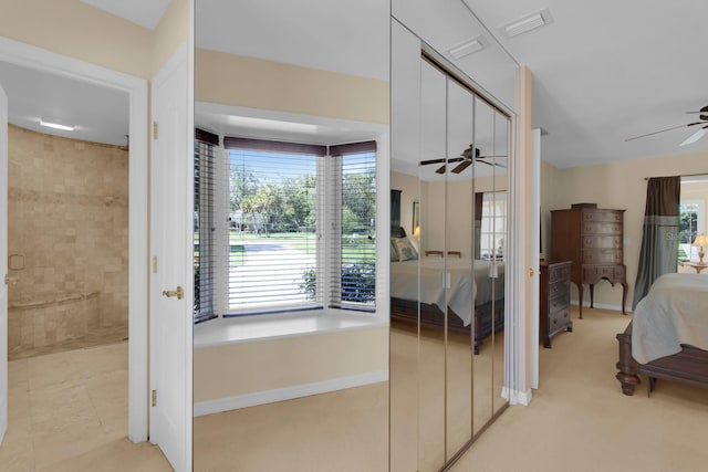 303 S Sweetwater Blvd, Longwood, FL 32779 - ensuite bathroom featuring a ceiling fan and a tile shower