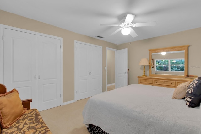 303 S Sweetwater Blvd, Longwood, FL 32779 - bedroom featuring multiple closets, light carpet, a ceiling fan, and baseboards