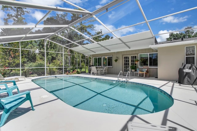 303 S Sweetwater Blvd, Longwood, FL 32779 - swimming pool featuring french doors, a patio, and glass enclosure