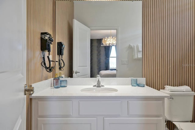 4441 Ganesha Loop, Kissimmee, FL 34746 - ensuite bathroom featuring vanity, toilet, and a chandelier