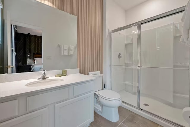 4441 Ganesha Loop, Kissimmee, FL 34746 - bathroom featuring a shower stall, ensuite bath, toilet, and tile patterned floors