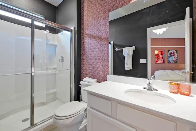 4441 Ganesha Loop, Kissimmee, FL 34746 - full bathroom featuring a shower stall, toilet, vanity, ensuite bath, and wallpapered walls