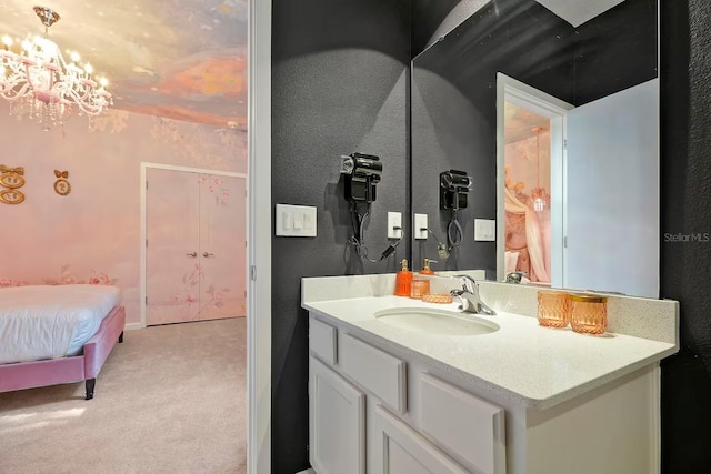 4441 Ganesha Loop, Kissimmee, FL 34746 - ensuite bathroom featuring vanity, a chandelier, and a textured wall