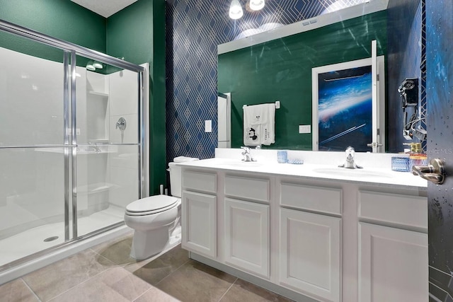 4441 Ganesha Loop, Kissimmee, FL 34746 - bathroom with toilet, a stall shower, double vanity, and tile patterned flooring